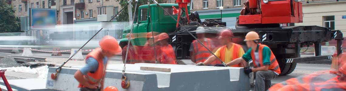 Workers fixing cables in street